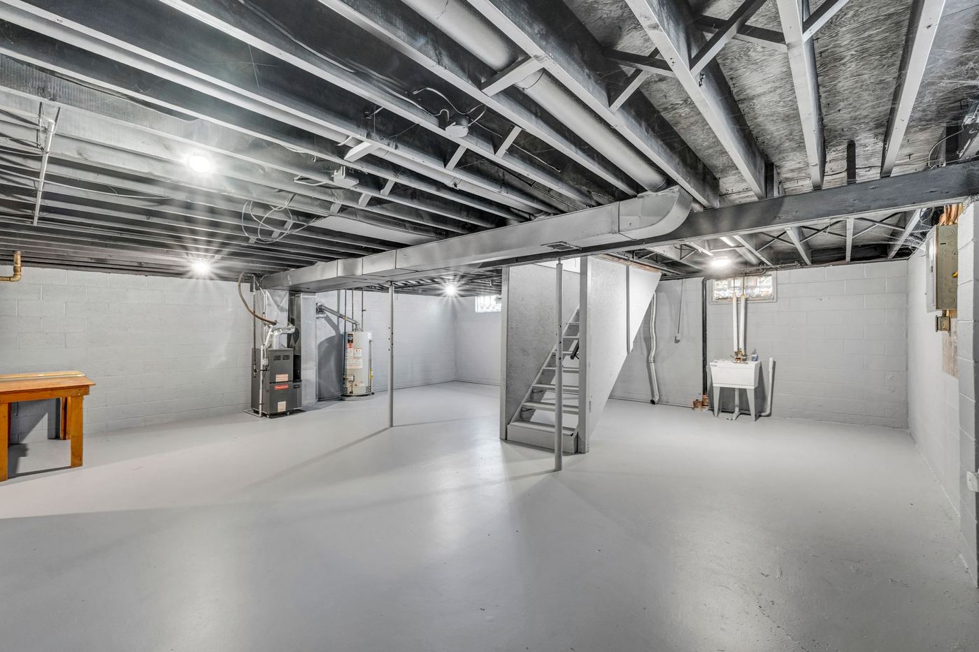 Unfinished basement with a concrete floor